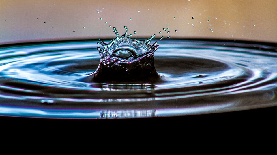 Image of water droplet impacting water